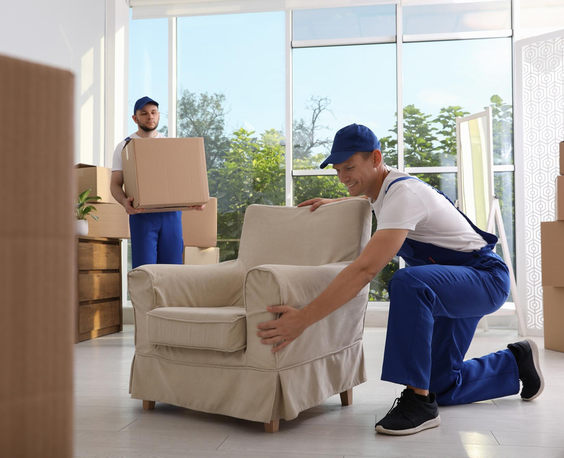 Movers carefully positioning furniture inside home – Moving Pro Dallas